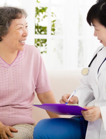 Devoted Care LLC caregiver reviewing care plan with senior client in Virginia